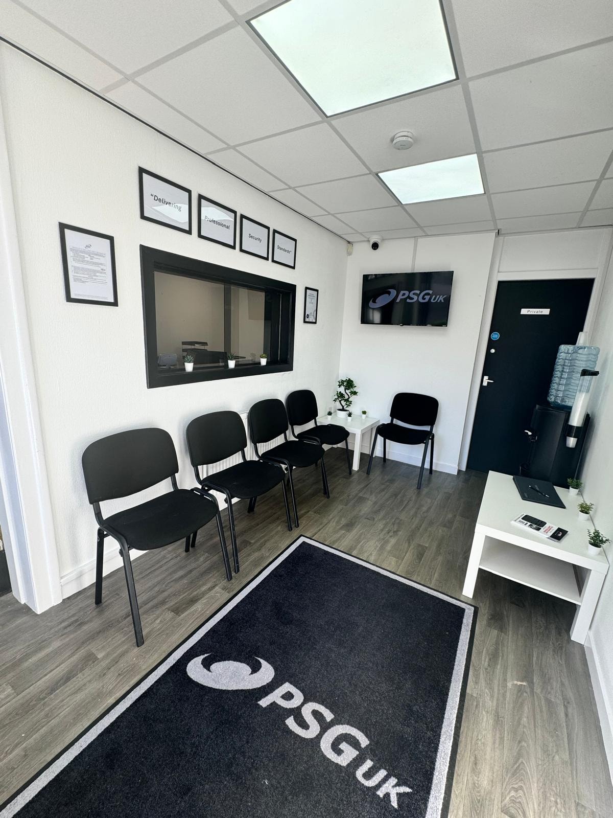 PSG UK Glasgow office waiting area with branded floor mat and PSG UK TV screen