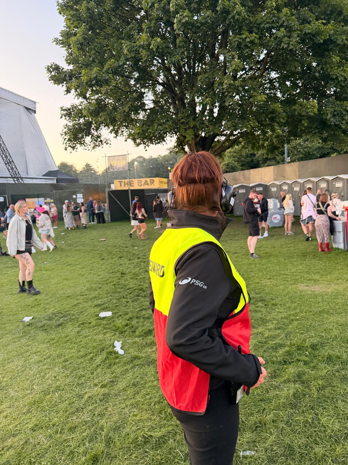 PSG UK steward in hi-vis vest at outdoor festival
