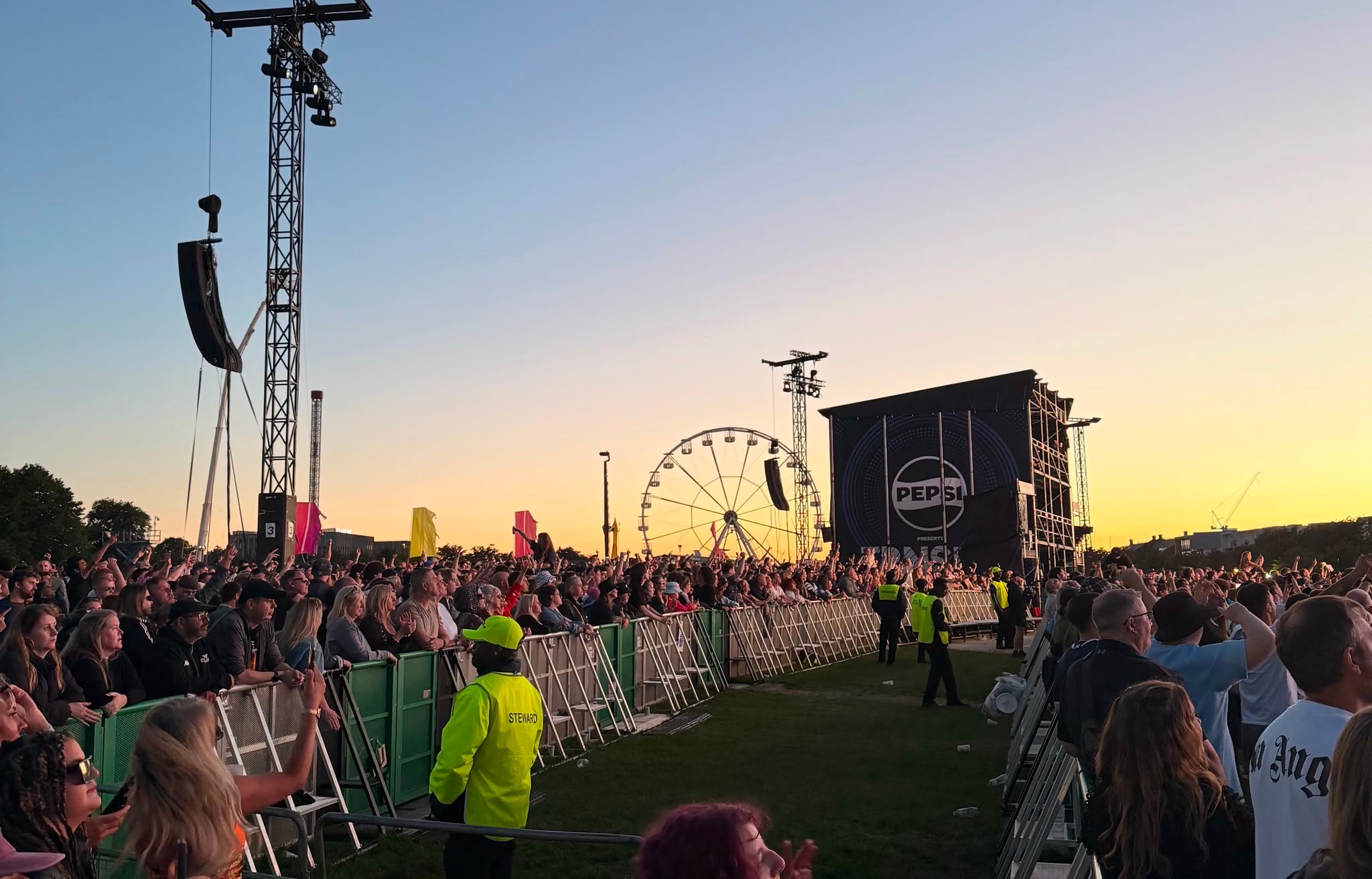 PSG UK steward managing crowd at TRNSMT festival at sunset